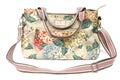 A colorful ladies sling bag with floral printings