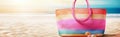 Colorful lady beach bag on sand on sea shore. Summer vacation or holiday concept background. Created with generative Ai Royalty Free Stock Photo