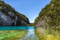 Colorful lake framed by steep rocks - Plitvice lakes in Plitvice National Park, Croatia Royalty Free Stock Photo
