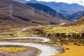 Colorful landscape with beautiful mountain road with a perfect asphalt. High rocks, blue sky at sunrise in summer Royalty Free Stock Photo