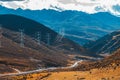 Colorful landscape with beautiful mountain road with a perfect asphalt. High rocks, blue sky at sunrise in summer Royalty Free Stock Photo