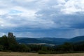 Colorful landscape with fields and meadows in Eifel mountains, Germany Royalty Free Stock Photo