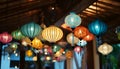 Colorful lanterns hang elegantly from the rooms ceiling Royalty Free Stock Photo