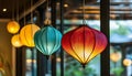 Colorful lanterns hang elegantly from the rooms ceiling Royalty Free Stock Photo