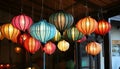 Colorful lanterns hang elegantly from the rooms ceiling Royalty Free Stock Photo