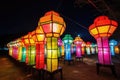 colorful lanterns illuminate the night sky during a cultural festival