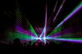 Colorful laser show nightlife club stage with party people crowd Royalty Free Stock Photo