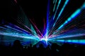 Colorful laser show nightlife club stage with party people crowd Royalty Free Stock Photo