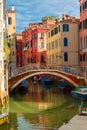 Colorful lateral canal and bridge in Venice, Italy