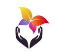 Colorful leaf butterfly in hand logo vector. Royalty Free Stock Photo