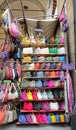 Colorful leather purses, handbags, wallets and handbags are displayed by street vendors at the outdoor Lorenzo Market at