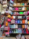 Colorful leather purses, handbags, wallets and handbags are displayed by street vendors at the outdoor Lorenzo Market at Royalty Free Stock Photo