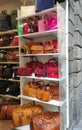 Colorful leather purses, handbags, wallets and handbags are displayed by street vendors at the outdoor Lorenzo Market at Royalty Free Stock Photo