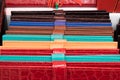Colorful leather wallets arranged on a column