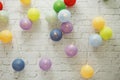 LED cotton ball decorative on white brick wall background Royalty Free Stock Photo