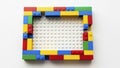 Colorful Lego bricks frame a white baseplate creative construction Royalty Free Stock Photo