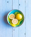 Colorful Lemon fruits over a light blue painted wood table Royalty Free Stock Photo