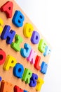 Colorful letter blocks on board on white Royalty Free Stock Photo