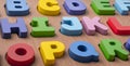 Colorful letter blocks on board on white Royalty Free Stock Photo