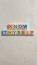 Colorful Letter Blocks Spelling Know Thyself on Stone Background Royalty Free Stock Photo