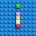 Colorful letter I from building lego bricks on blue lego background. Lego letter M