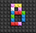 Colorful letters B of alphabet from building lego bricks on black lego brick background. lego background. 3d letters