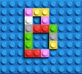 Colorful letters B of alphabet from building lego bricks on blue lego brick background. blue lego background. 3d letters C. Realis