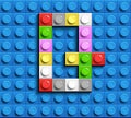 Colorful letters G of alphabet from building lego bricks on blue lego brick background. blue lego background. 3d letters C. Realis