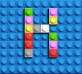 Colorful letters K of alphabet from building lego bricks on blue lego brick background. blue lego background. 3d letters C. Realis