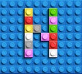 Colorful letters N of alphabet from building lego bricks on blue lego brick background. blue lego background. 3d letters C. Realis