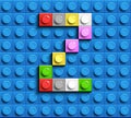 Colorful letters Z of alphabet from building lego bricks on blue lego brick background. blue lego background. 3d letters C. Realis