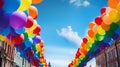 Colorful LGBTQ pride parade balloons floating in the air