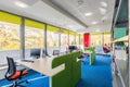 Colorful library interior with desks