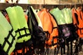 Colorful life jackets hanging on the row Royalty Free Stock Photo