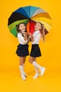 Colorful life. Schoolgirls happy big umbrella. Fall weather forecast. Place for both of us. Fashion accessory. Girls