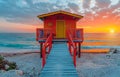 Colorful lifeguard station sits on the beach at sunset Royalty Free Stock Photo