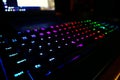 Colorful light Gaming Red Green Blue RGB Keyboard. Dark cool gamer equipment gear, night mode, modern high technology, close up