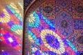 Colorful light from stained glass window on the wall of Nasir Ol-Molk mosque, also famous as Pink Mosque. Shiraz. Iran Royalty Free Stock Photo