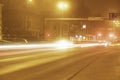 Colorful light traces from busy night traffic on the Umea city street, foggy autumn weather, Sweden Royalty Free Stock Photo