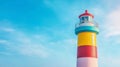 Colorful lighthouse,minimalist style, bright blue sky, frontal view,calmness,copy space Royalty Free Stock Photo