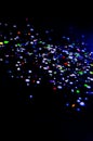 Colorful lights blurred glitter background. Abstract illuminated texture. Christmas, new year or birthday celebration. Night life Royalty Free Stock Photo