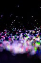 Colorful lights blurred glitter background. Abstract illuminated texture. Christmas, new year or birthday celebration. Night life Royalty Free Stock Photo