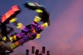 Colorful Lights Of Carnival Ride Motion Blur At Dusk Royalty Free Stock Photo