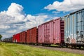 A Colorful Line of Railway Boxcars in Summer