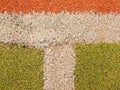 Colorful lines in empty outdoor handball playground, plastic light green surface on ground and white, red and blue bounds lines. Royalty Free Stock Photo