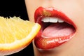 Colorful lips eating lemon