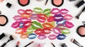 Colorful lipstick kiss prints surrounded by makeup essentials on a bright white background. Royalty Free Stock Photo