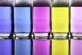 Colorful liquid chemical cleaning agents in glass bottles Royalty Free Stock Photo