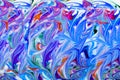 Colorful liquid paints mixed together creating modern abstract