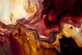 Colorful liquid paints mixed together creating modern abstract